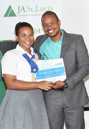 Image: 1st place National Achiever of the year goes to Zenna Hadeed of the Corinth Secondary School who also got a handset compliments FLOW from Flow Communications Specialist Terry Corwin Finnisterre.