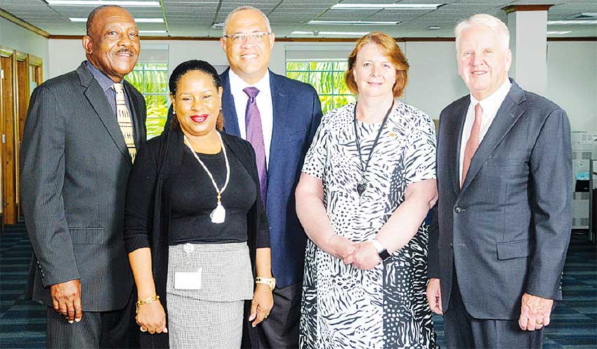Image: Outgoing Chief Executive Officer; Gary Brown (right) Colette Delaney, CEO Designate and new Chair of the FirstCaribbeanComTrust Foundation (second right); Mark St. Hill, Trustee and Managing Director, Retail and Business Banking, Debra King, Trustee and Director of Corporate Communications; Clenell Goodman, Trustee. Missing are: Lynda Goodridge, Trustee and overseas-based Trustees Trevor L. Torzsas and Ladesa James-Williams.
