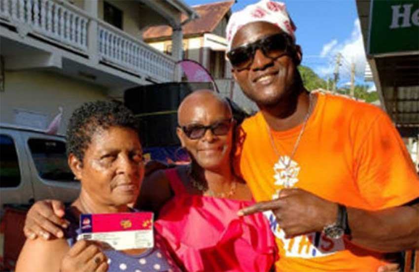 Image of Darren Sammy pointing to tickets he wants Saint Lucians to buy, to support defending champions at home,