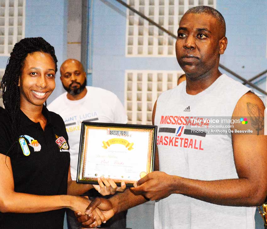 Image of Shervon Matthew (RSLPF) receiving his award from a representative of SLBF (Photo: Anthony De Beauville)