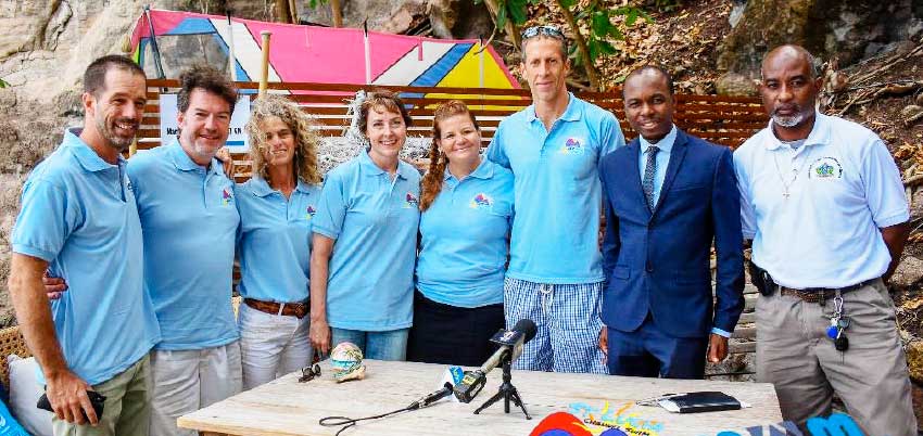 Image: (L-R) Weston Moses, Paul Nance, Lily Bergasse, Molly Nance (the eventual swimmer), Sue Dyson, Nathaniel Waring, Tourism Minister - Dominic Fedee and Director of Sports in the Department of Youth Development and Sports - Patrick Mathurin (Photo: SLCS)