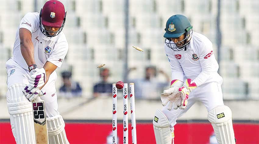 Image: West Indies batsman Kieran Powell loses his off stump. (PHOTO: AFP)