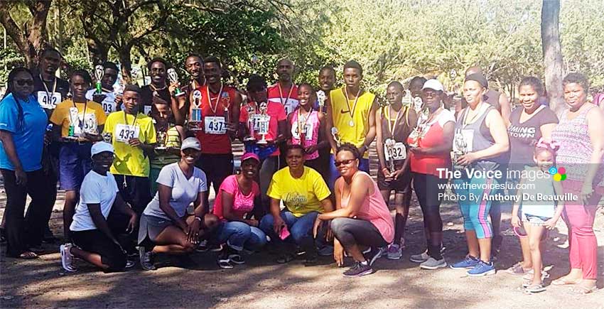 Image: A photo moment for top winners of the various age groups and volunteers following the event. (PHOTO: Anthony De Beauville)