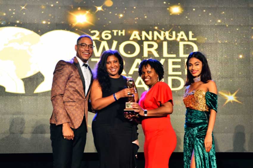 Image: Accepting award for ‘Caribbean’s Leading Honeymoon Destination’