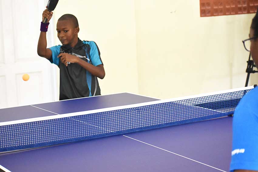 Image: Youth in community enjoying a game of table tennis equipment