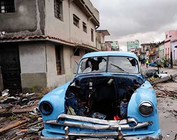 Image: Vintage vehicle among debris after tornado