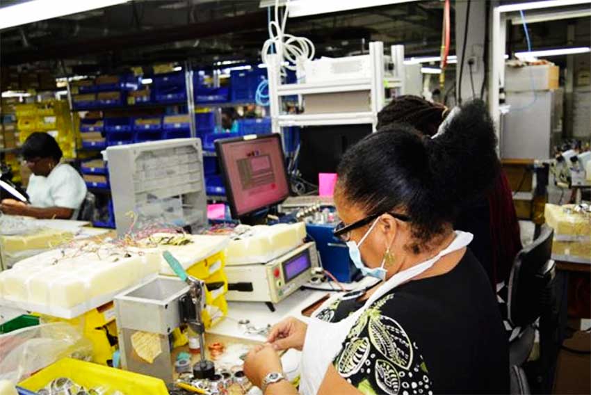 Image: Workers at API Harowe St. Kitts Ltd. busy at work.