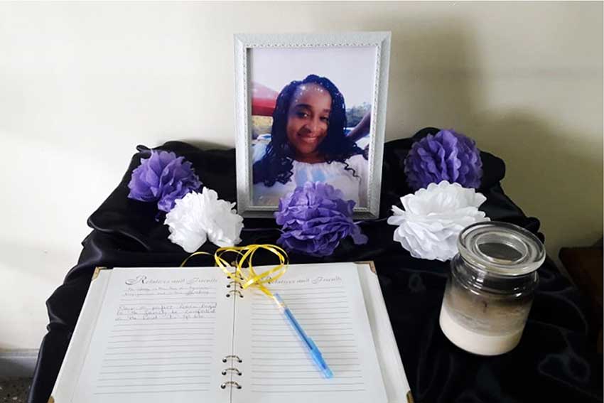 Image of A memorial which was set up at the Office of the Commissioner of Police in memory of Tamara Charles Laure.