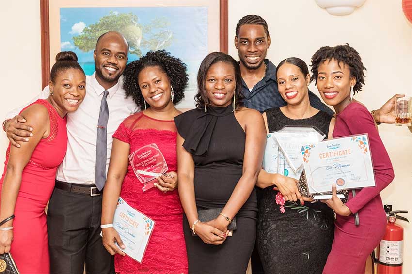 Image of winners showing off their awards at the end of the event