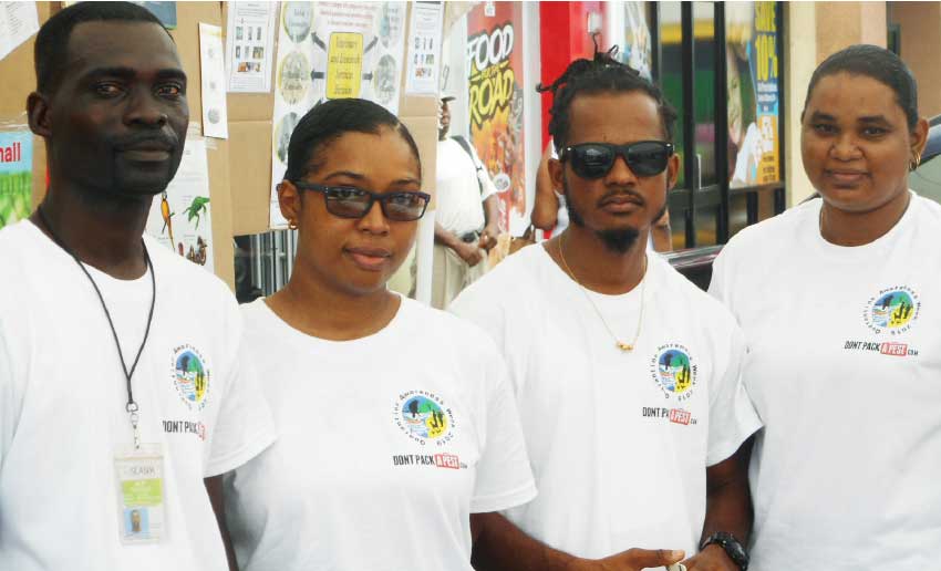 Image of Dr. Edmond Kitanda, Veterinary and Livestock Officer attached to the Beausejour Agricultural Complex in Vieux Fort extreme (left) and members of his staff.