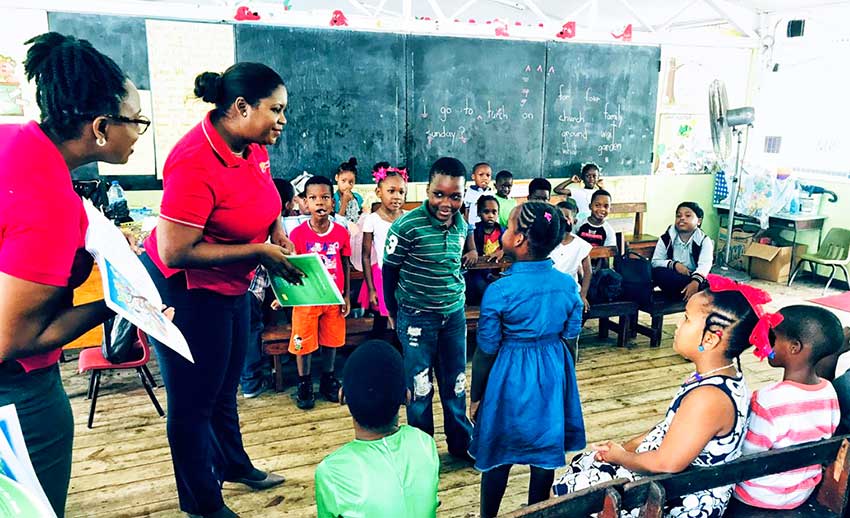 Image: Reading teams from CIBC visited infant and preschools with story-books, colouring books and fruit hampers for children.