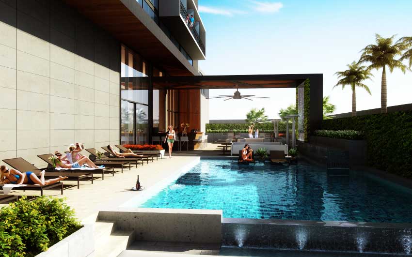 Image of the outdoor pool at the Stewart family owned AC Hotel in Kingston, Jamaica. 