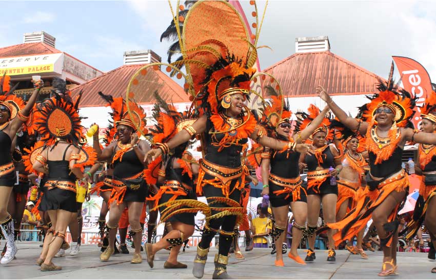 Carnival revellers dancing at the carnival day parade