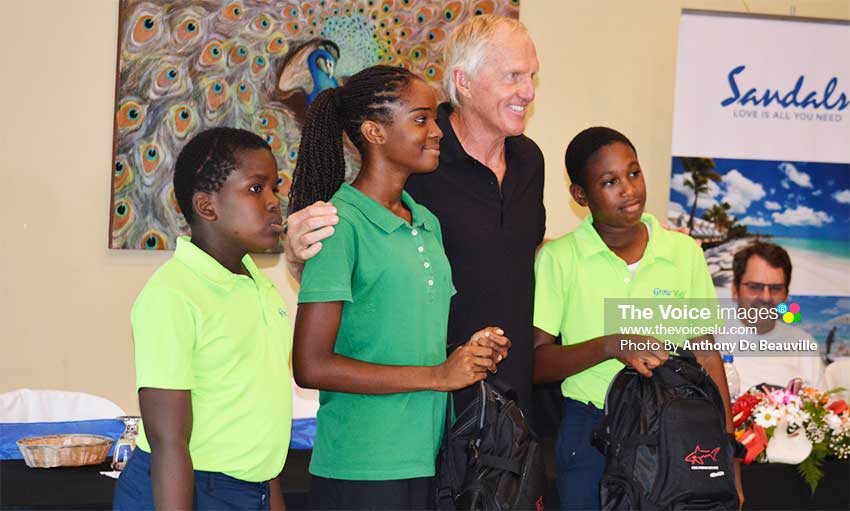 Image: A proud moment for three Grow Well young aspiring golfers, they each received a bag pack with school supplies from Greg Norman/Sandals . PHOTO: Anthony De Beauville)