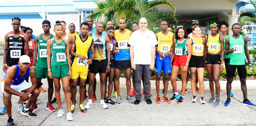 A photo moment for Caricom Secretary-General Ambassador Irwin LaRocque and race participants on Sunday. (PHOTO: NM) 