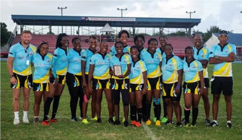 Image: From left: Matt Jess (Coach), Zhenya Allain (Team Physiotherapist), Mary Roberts, Kisha Edgar, Loianna Alexander, Renetta Fredericks, Electra Marcelle (captain), Marline Cherry (vice-captain), Genesis Alfred, Shawnette St Juste, Winnie Della Rene, Kameka President, Kera Dornelly, Marissa Wilfred, Roger Butcher (Team Manager and President of the SLRFU), Willet Pantor (Technical Director and Coach). (PHOTO: SLRFU)