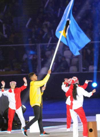 Image of Saint Lucia's Flag Bearer Luc Chevrier. (PHOTO: David Pascal)