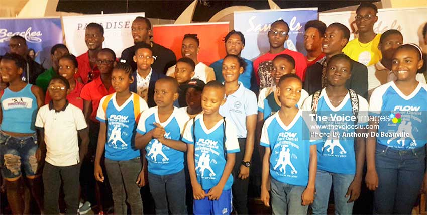 Image: Saint Lucia’s young and aspiring sports personalities with Daren Sammy, Usain Bolt and Dwayne Bravo .  PHOTO: Anthony De Beauville)