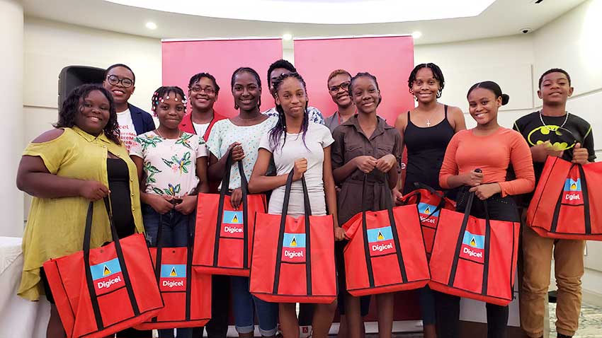 Image of Digicel Executives with Scholarship recipients 