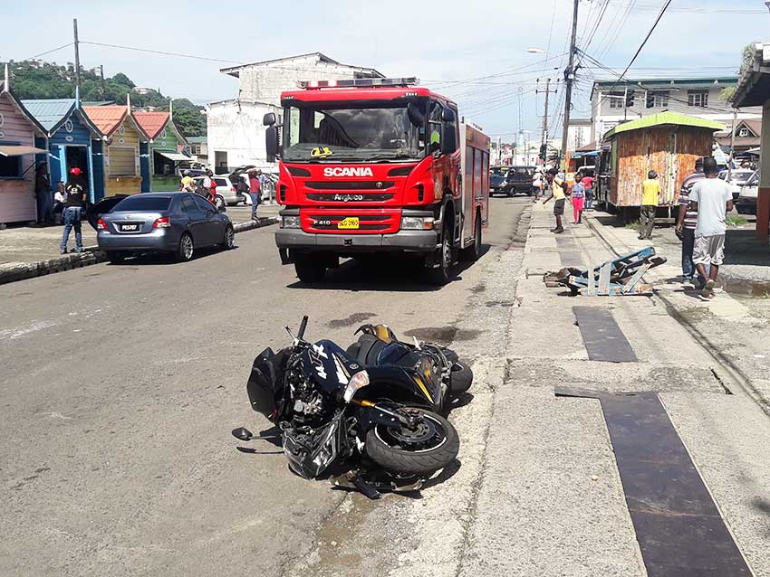 Image of a motorcycle on the road after accident. 