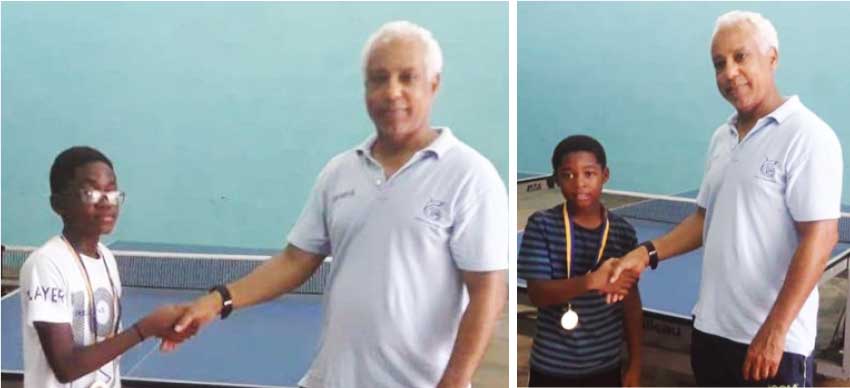 Image: (L-R) Under 13 and 11 National Table Tennis Champions, Nathan Alexander and Leshon Francis receiving their medals from SLTTA President Teddy Mathews. (Photo: SLTTA)