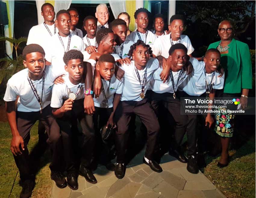 Image: National Under 15 Boys celebrating with Prime Minister Allen Chastanet and SLOC President Fortuna Belrose. (Photo: Anthony De Beauville)