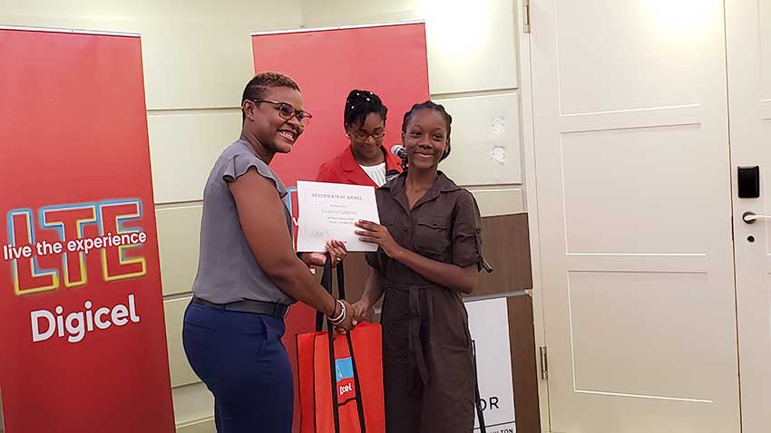 Image of Digicel St. Lucia CEO, Siobhan James-Alexander with one of elated Scholarship recipients