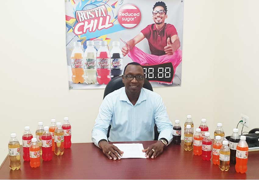 Image of Gaius Harry, Assistant General Manager, SMJ Beverages Saint Lucia, announcing the arrival of the new Busta Chill.