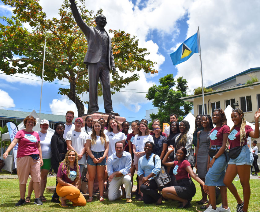 Image: Marine Science students (centre), with Geography and Psychology students; British High Commissioner, Steve McCready and Caribbean Elective representatives Harry Spear and Matt Barry at Constitution Park, Castries. 