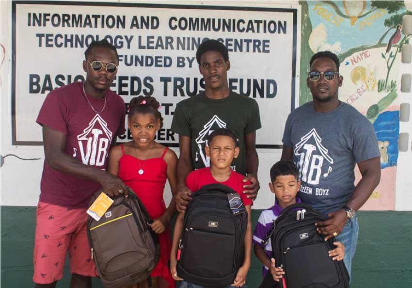 Image of Vye Twizeen Boyz with the lucky recipients. 