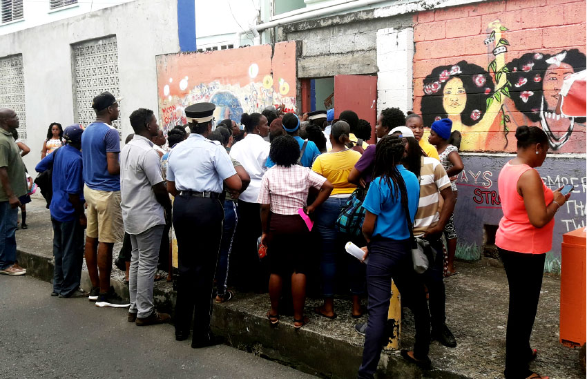 Image: A crowd of parents outside the Ave Maria Girls’ Infant School on Monday.