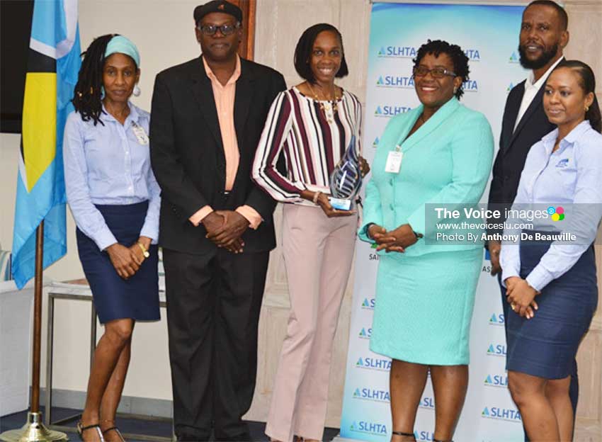 Image: (L-R) Allison Dudley - SLHTA, Kirt Elliott - SLHTA Director, Levern Spencer - SLHTA Goodwill Ambassador, Suzette Jean - Deputy Permanent Secretary, Ministry of Tourism, Benson Emile - Permanent Secretary, Ministry of Youth Development and Sports and Yola St Jour - SLHTA Finance Administration Officer. (PHOTO: Anthony De Beauville)