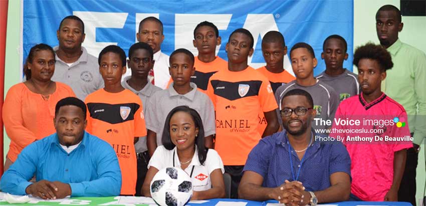 Image: (Front Row) A photo moment for GIFL President Shane Paul, Guardsman Saint Lucia Limited representative Pauline Francis,CAP D: GIFL Vice President Charde Desir; (Back Row) coaches, managers and players from the various teams. (PHOTo: Anthony De Beauville) 