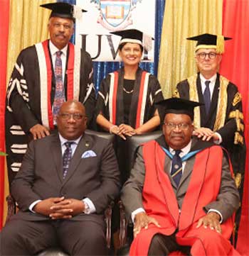 Image: Standing (L-R) Vice-Chancellor Professor Sir Hilary Beckles, Pro Vice-Chancellor and Principal Dr. Luz Longsworth and Chancellor Robert Bermudez with Governor-General of St Kitts and Nevis Sir TapleySeaton (seated at right) and Dr Timothy Harris, Prime Minister of St Kitts and Nevis.