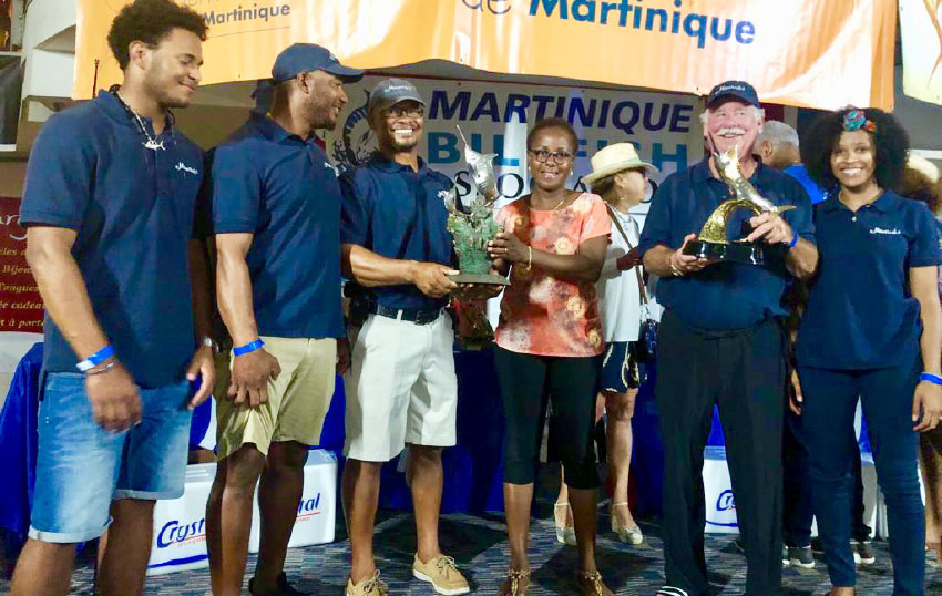 Image: Team Maverick celebrating their win; Lily Thomas at right. 