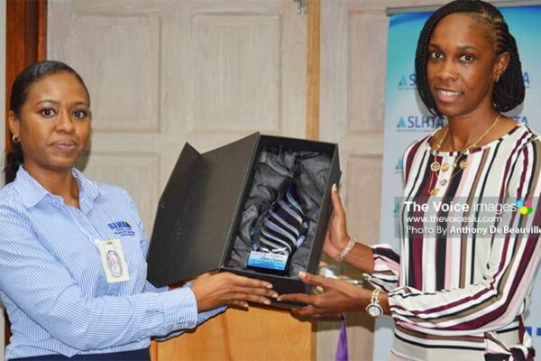 Image: (L-R) SLHTA Finance and Administration Officer, Yola St Jour presenting Levern Spencer with the Goodwill Ambassador Award. (PHOTO: Anthony De Beauville)