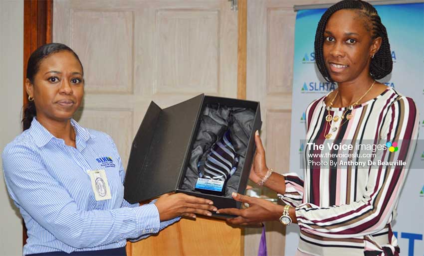 Image: (L-R) SLHTA Finance and Administration Officer, Yola St Jour presenting Levern Spencer with the Goodwill Ambassador Award. (PHOTO: Anthony De Beauville)