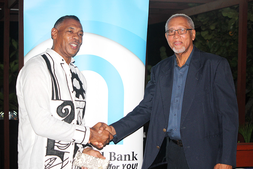 Image of Adrian Augier (left) and Johnson Cenac, outgoing directors of 1st National Bank.