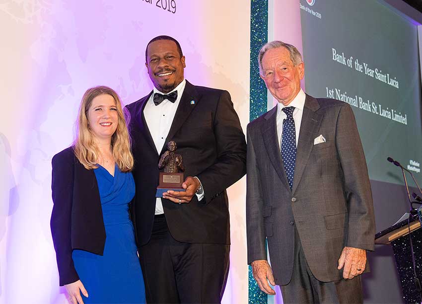 Image of Managing Director Johnathan Johannes (center) collecting the Bracken Bank of the Year Award on behalf of 1st National Bank. 