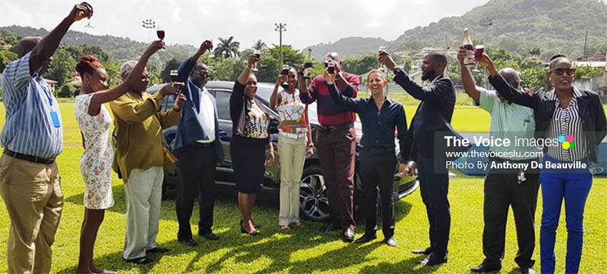 Image: Minister of Sports and Ministry officials, Kia representative and well wishers hail three cheers and a toast of non-alcoholic champagne to the high jump Queen, Levern Spencer. (PHOTO: Anthony De Beauville)