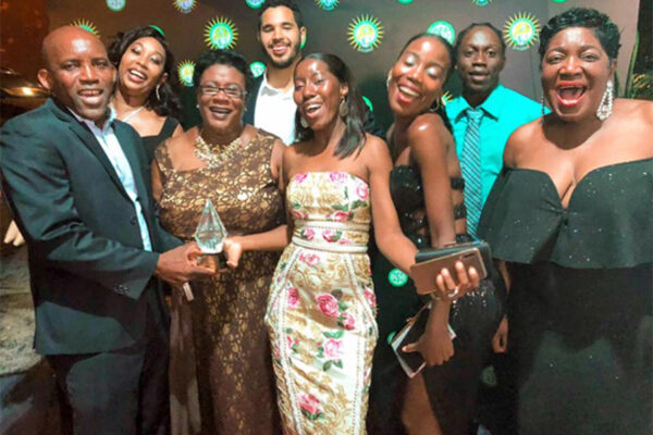 Image: Waltrude Patrick, General Manager of Bay Gardens Beach Resort & Spa (third from left), and Berthia Parle MBE, Retired General Manager (far right), celebrate with team members at the St Lucia Business Awards ceremony last weekend.