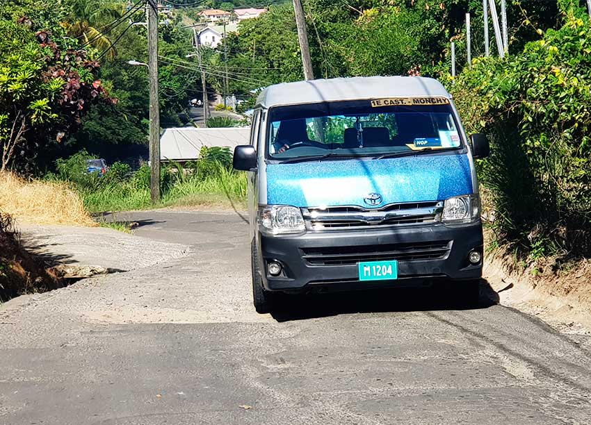 Image: Minibus operators are forced on to the side of the road to avoid a pothole.