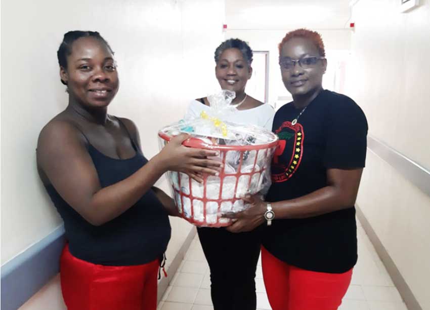 Image of Nadia Aurelien receiving her goodwill hamper.