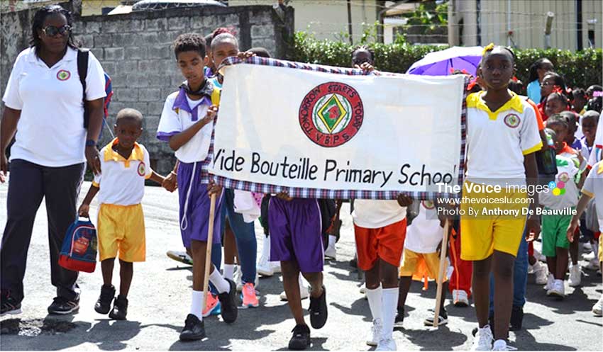 Image: Vide Bouteille Primary School Principal Lyrill Arthur Stanislaus (far left) takes charge of her troop. (Photo: Anthony De Beauville) 