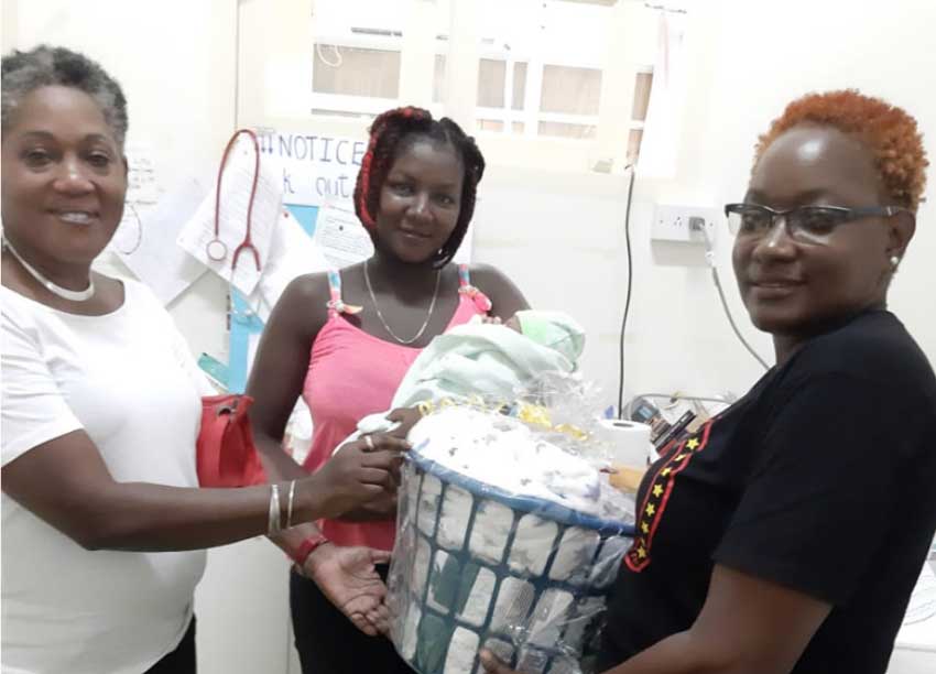 Image of Virgil Thomas receiving her goodwill hamper.