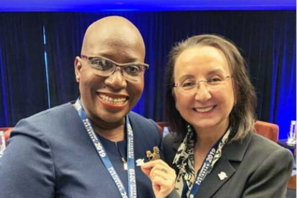 Image: Dr Gale Rigobert, St Lucia’s Minister for Education, Innovation, Gender Relations and Sustainable Development (left), receives the Caribbean Challenge Initiative pin from CCI Special Envoy Karolin Troubetzkoy.
