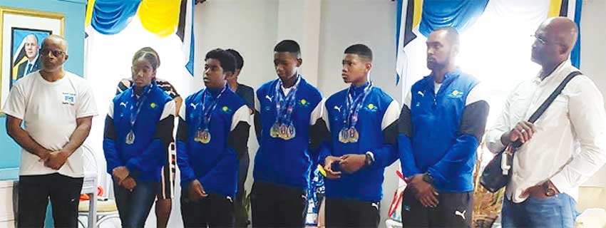 Image: (L-R) SLAF President – Eddie Hazell, Naima Hazell, Ethan Hazell, Karic Charles, Tristan Doville and Team Manager – Martin Dorville taking in some of the congratulatory messages. (PHOTO: SM) 