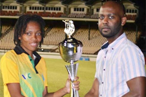 Image: Saint Vincent and the Grenadines captain EdelynTurtin receiving the 50 Overs championship trophy from CWI Vice President Shallow; Saint Lucia captain Ashlene Edward receiving the T20 Championship trophy from SLNCA President, Carol Henry. (PHOTO: Anthony De Beauville)