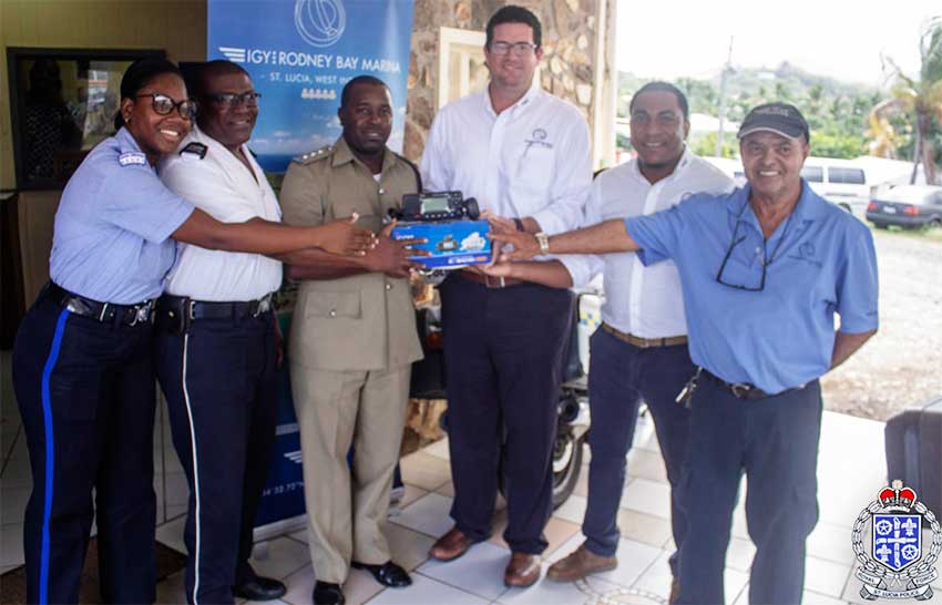 Image: IGY Rodney Bay Marina representatives presenting the new marine VHF radio to police officers from the Gros Islet Police Station.