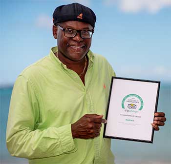 Image of Kirk Elliott with TripAdvisor Certificate.
